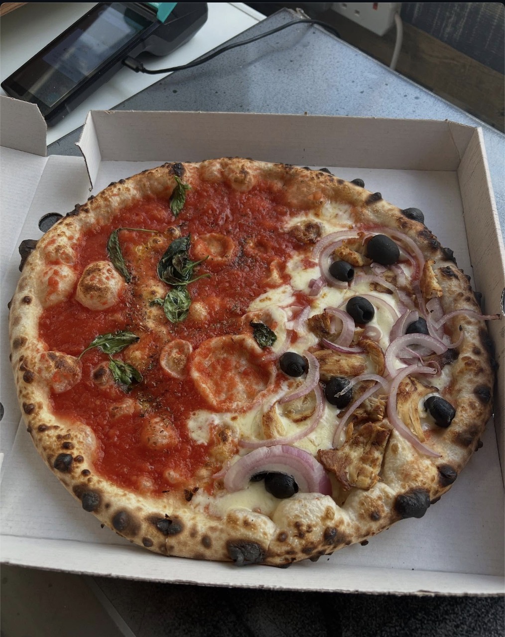 Half margherita, half chicken and red onion Neapolitan pizza